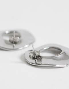 Model wearing Francis waterproof stainless steel round earrings in silver brushed