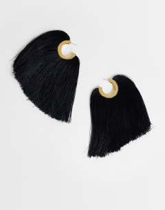 Model wearing Franklin hoop tassel earrings in black