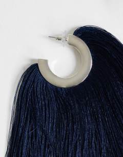 Model wearing Franklin hoop tassel earrings in navy