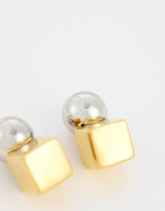 Model wearing Freya stainless steel two tone stud earring in silver and gold