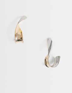 Model wearing Freyja twisted earring in gold and silver