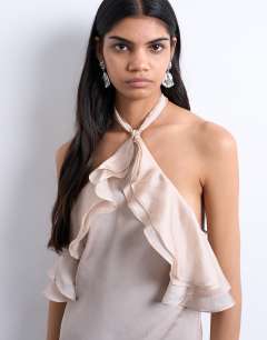 Model wearing Frill halter neck maxi dress in iridescent mink