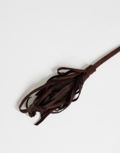 Model wearing Fringe cord suedette belt in chocolate