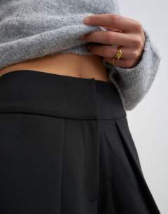 Model wearing Front pleat wide leg trouser in black