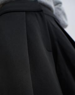 Model wearing Front pleat wide leg trouser in black