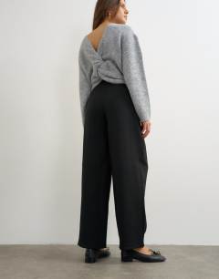 Model wearing Front pleat wide leg trouser in black