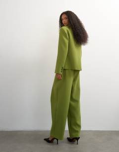 Model wearing Front pleat wide leg trouser in olive