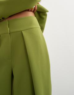 Model wearing Front pleat wide leg trouser in olive