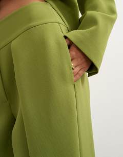 Model wearing Front pleat wide leg trouser in olive