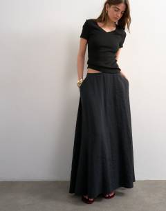 Model wearing Full circle cupro maxi skirt in black