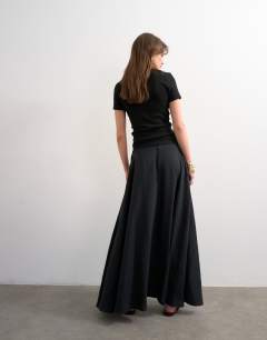 Model wearing Full circle cupro maxi skirt in black
