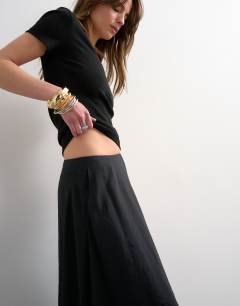 Model wearing Full circle cupro maxi skirt in black
