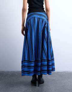 Model wearing Full circle cut about maxi skirt in blue and black stripe