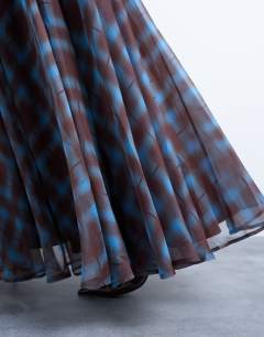 Model wearing Full circle maxi skirt in blue check