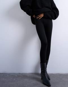 Model wearing Full length heavy weight legging in black