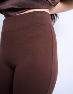 Model wearing Full length heavy weight legging in chocolate brown