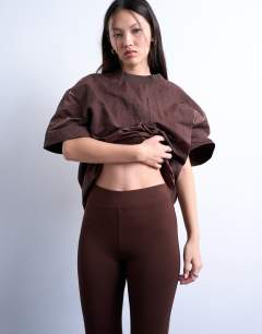 Model wearing Full length heavy weight legging in chocolate brown