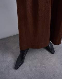Model wearing Full maxi skirt in brown with black stripe