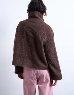 Model wearing Funnel boucle tab detail bomber in chocolate