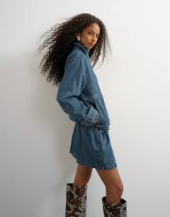 Model wearing Funnel bubble dress in mid blue