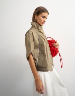 Model wearing Funnel mock sleeve sports top in olive