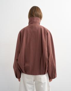 Model wearing Funnel neck bomber jacket in aubergine
