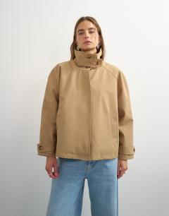 Model wearing Funnel neck cropped trench coat in camel