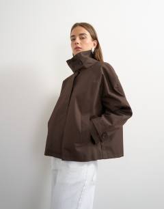 Model wearing Funnel neck cropped trench coat in chocolate