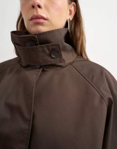 Model wearing Funnel neck cropped trench coat in chocolate