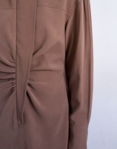 Model wearing Funnel neck cupro mini dress in chocolate