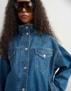 Model wearing Funnel neck denim jacket in green cast