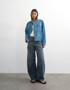 Model wearing Funnel neck elastic hem detail jacket mid blue