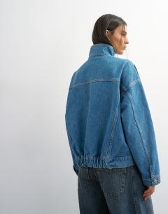 Model wearing Funnel neck elastic hem detail jacket mid blue