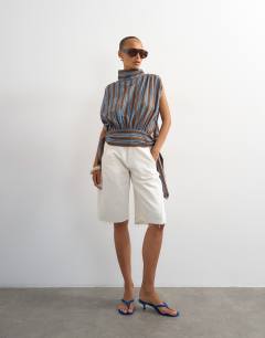 Model wearing Funnel neck gathered waist tie detail top in brown stripe