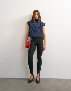 Model wearing Funnel neck grown on sleeve tech top in navy