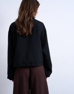 Model wearing Funnel Neck Jacket in black