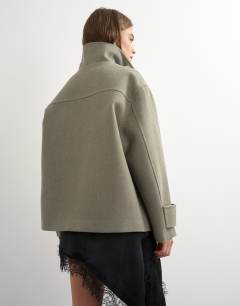 Model wearing Funnel neck jacket in grey