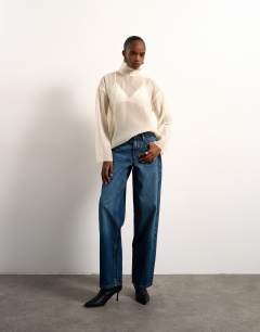 Model wearing Funnel neck long sleeve organza top in champagne