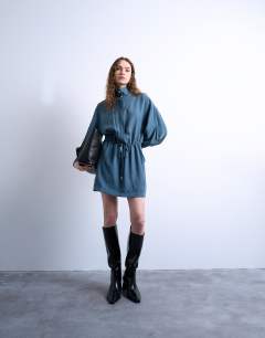 Model wearing Funnel neck mini dress in dusty blue