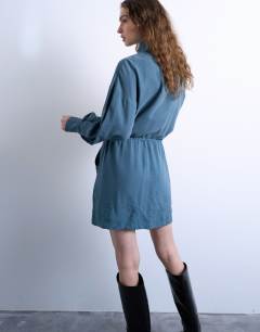 Model wearing Funnel neck mini dress in dusty blue