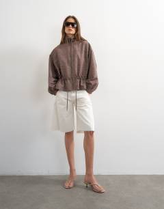 Model wearing Funnel neck nylon check anorak in multi