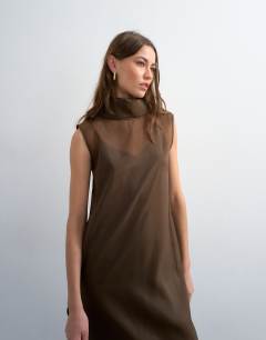 Model wearing Funnel neck organza sheer maxi dress in chocolate