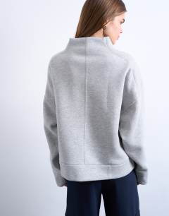 Model wearing Funnel neck oversized sweat in grey