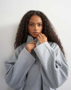 Model wearing Funnel neck quarter zip sweat in light grey