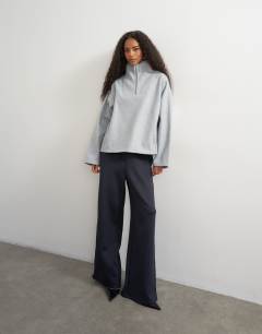 Model wearing Funnel neck quarter zip sweat in light grey