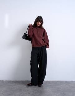 Model wearing Funnel neck seam detail sweatshirt in chocolate