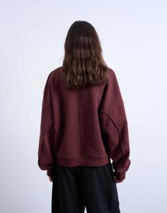 Model wearing Funnel neck seam detail sweatshirt in chocolate
