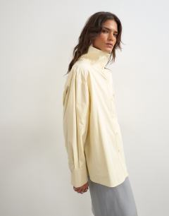 Model wearing Funnel neck shirt in buttermilk