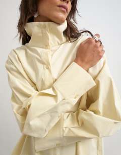 Model wearing Funnel neck shirt in buttermilk