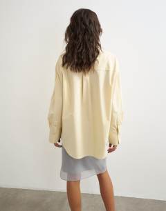 Model wearing Funnel neck shirt in buttermilk